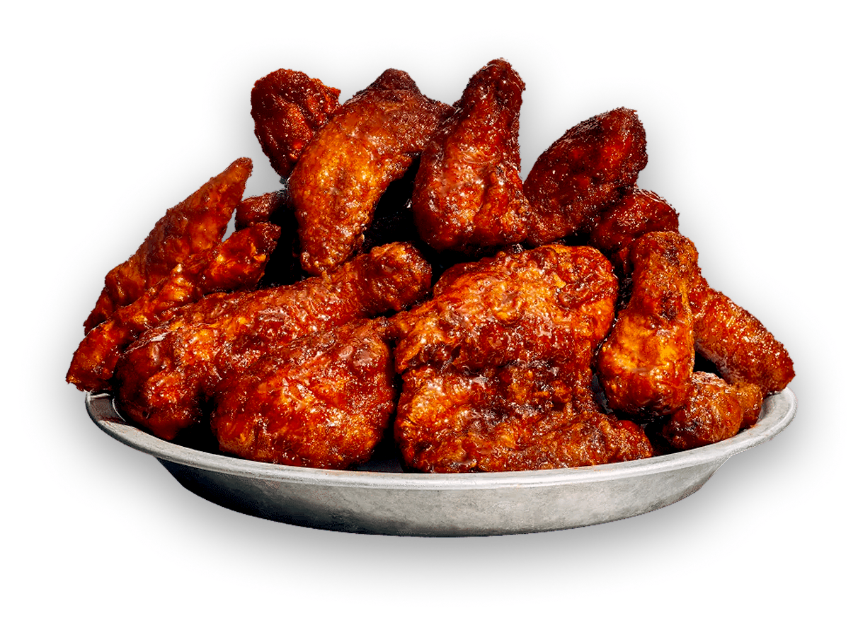 A plate of glazed Mad For Chicken wings